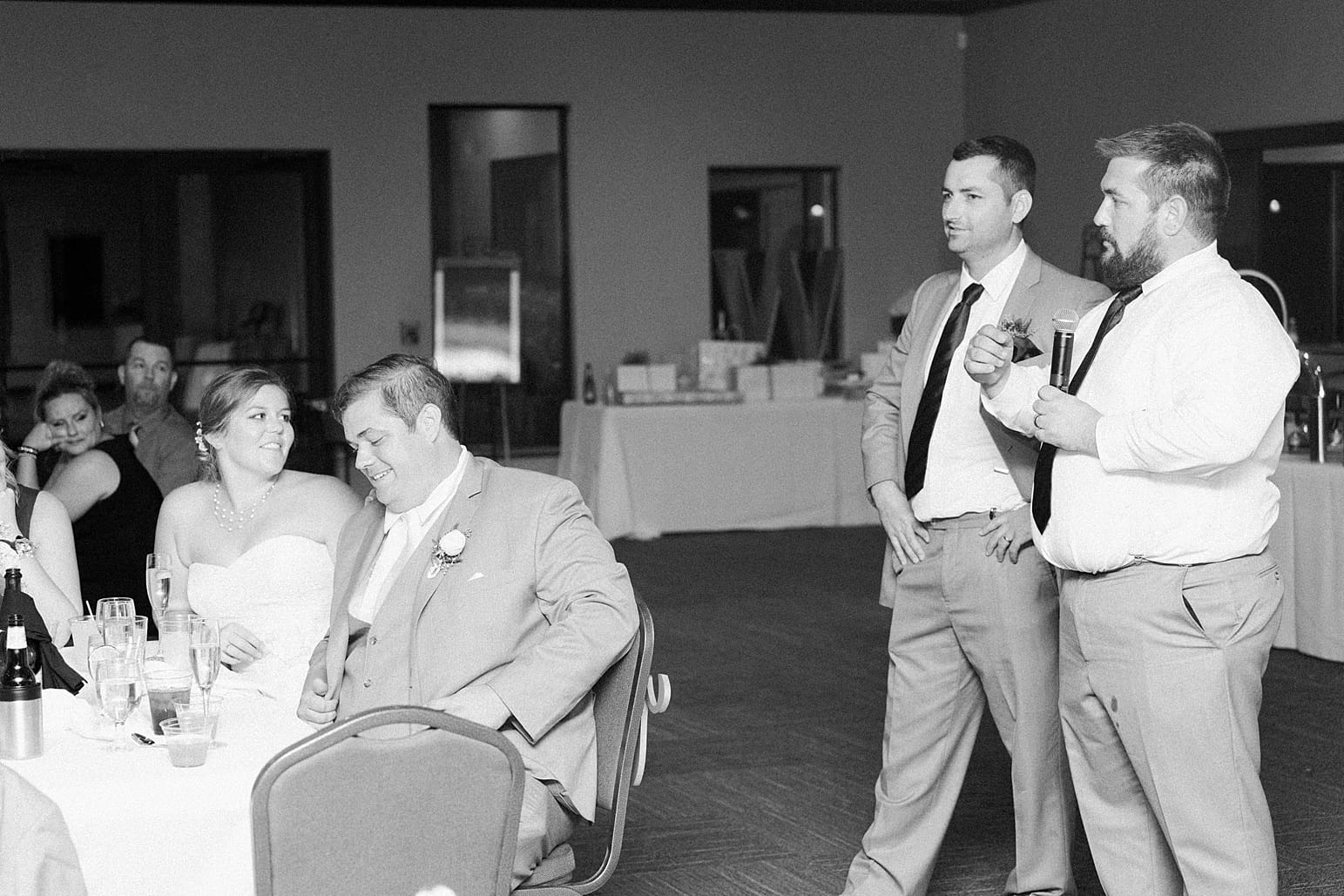 Arielle Peters Photography | Best man giving speech at wedding reception on wedding day at Sleepy Owl Restaurant in Syracuse, Indiana.