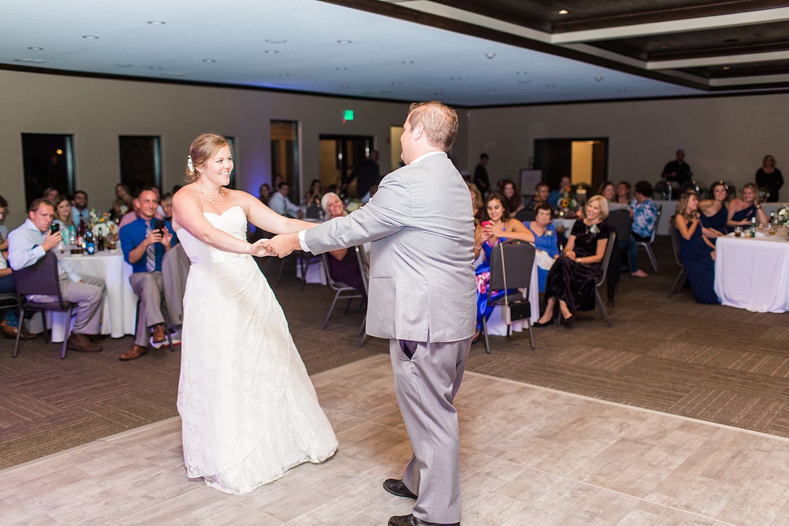 Arielle Peters Photography | Bride and groom sharing first dance on wedding day at Sleepy Owl Restaurant in Syracuse, Indiana.