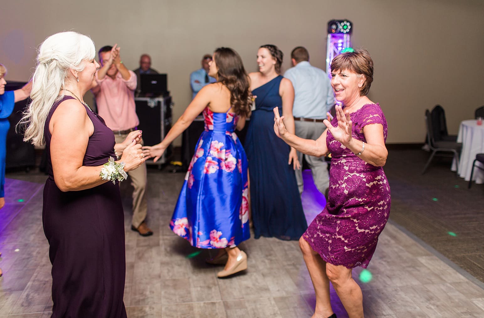 Arielle Peters Photography | Wedding guests dancing on wedding day at Sleepy Owl Restaurant in Syracuse, Indiana.