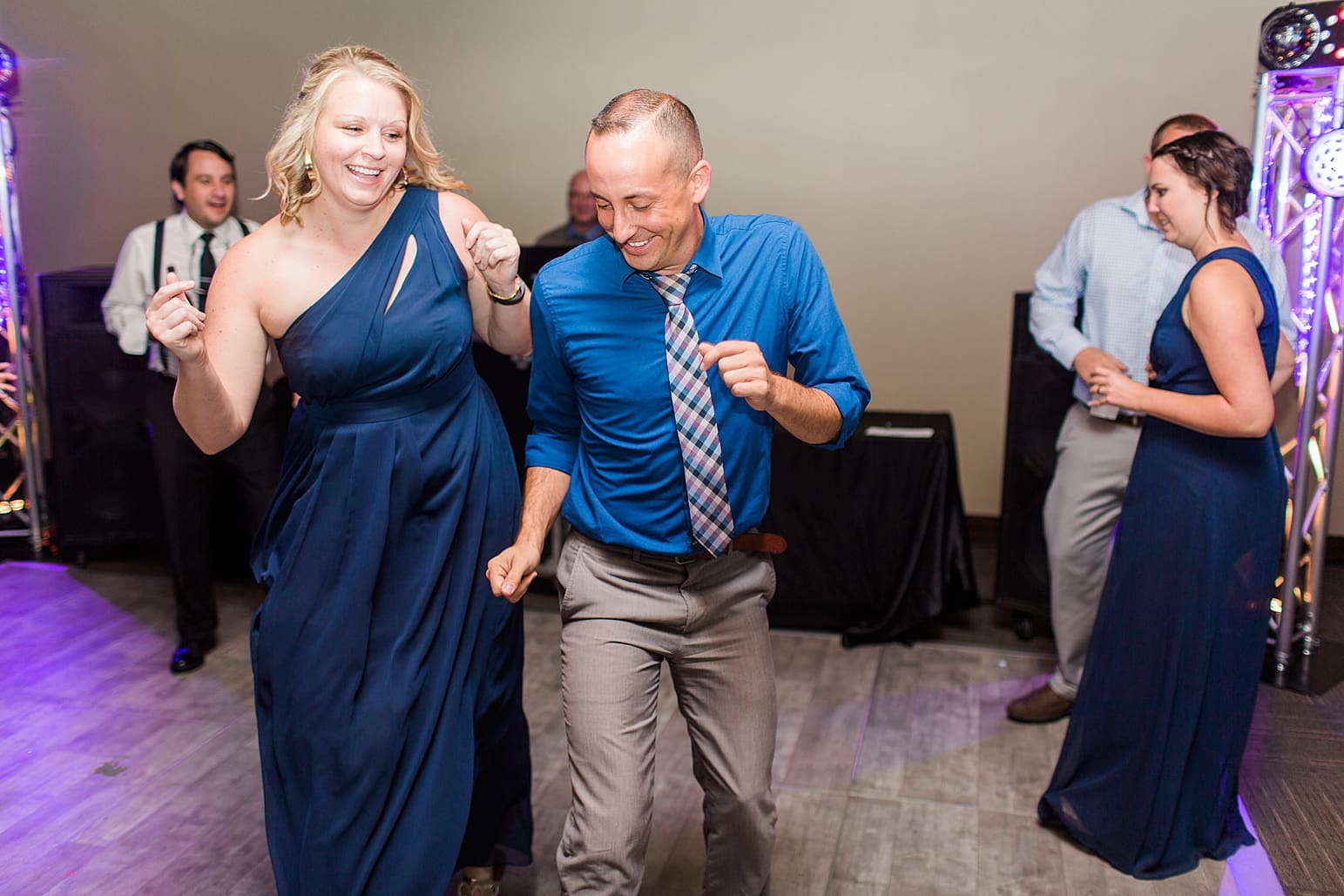 Arielle Peters Photography | Wedding guests dancing on wedding day at Sleepy Owl Restaurant in Syracuse, Indiana.