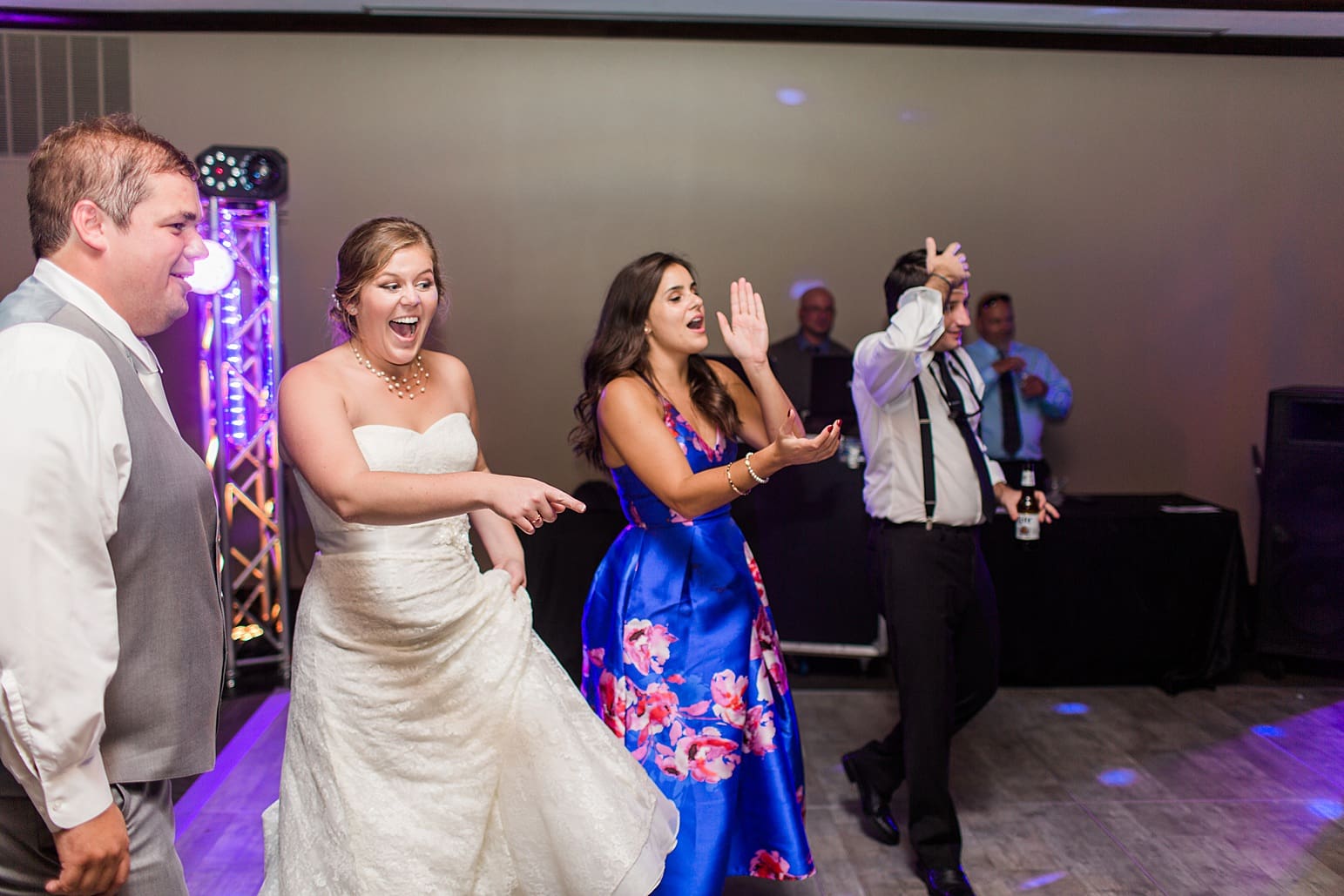 Arielle Peters Photography | Wedding guests dancing on wedding day at Sleepy Owl Restaurant in Syracuse, Indiana.