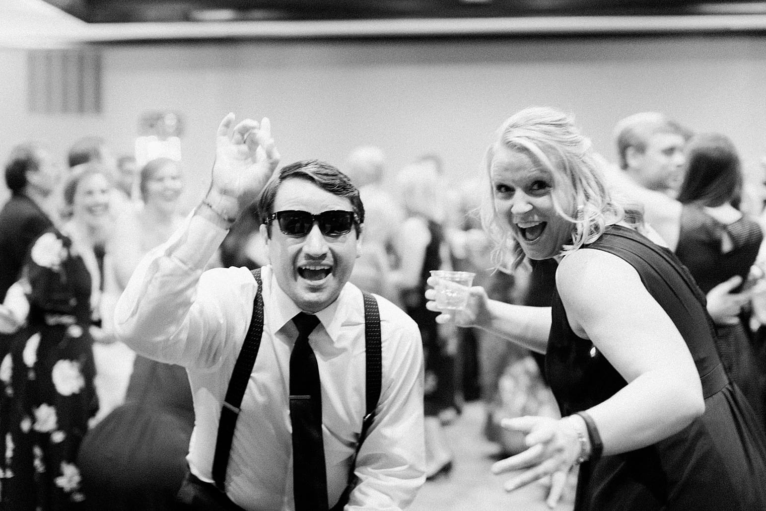 Arielle Peters Photography | Wedding guests dancing on wedding day at Sleepy Owl Restaurant in Syracuse, Indiana.