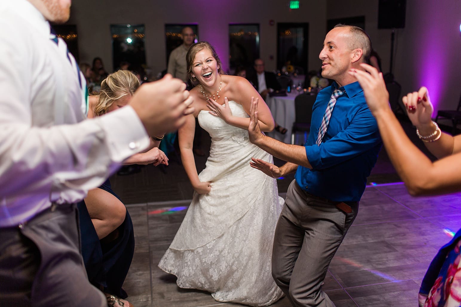 Arielle Peters Photography | Wedding guests dancing on wedding day at Sleepy Owl Restaurant in Syracuse, Indiana.