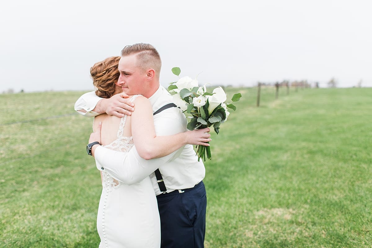Arielle Peters Photography | Bride and groom having first reveal in open green field on gloomy wedding day in Huntington, Indiana.