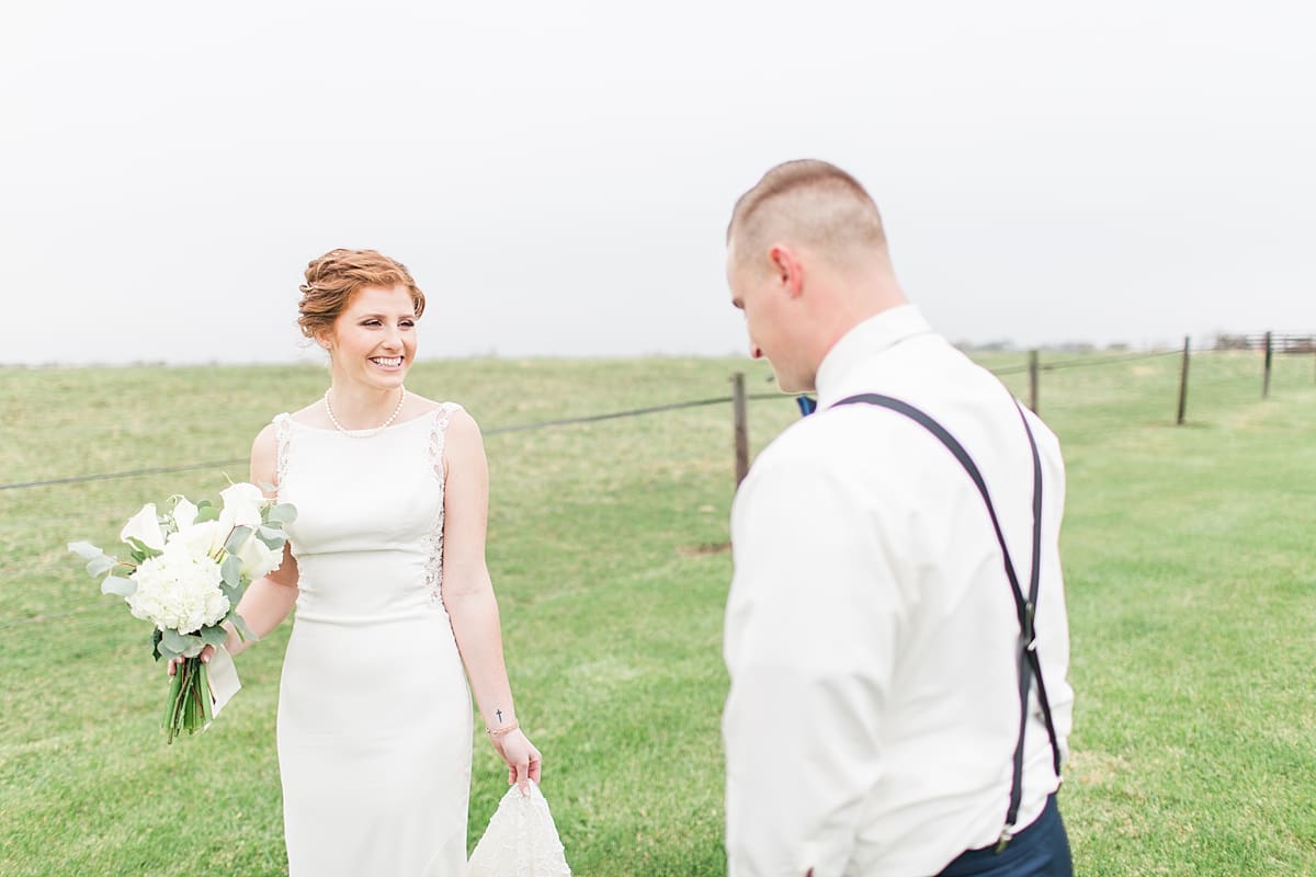 Arielle Peters Photography | Bride and groom having first reveal in open green field on gloomy wedding day in Huntington, Indiana.