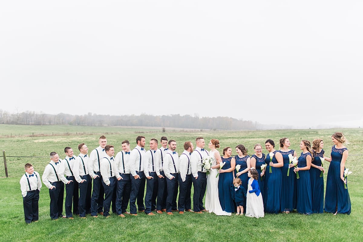 Arielle Peters Photography | Wedding party in open green field on gloomy wedding day in Huntington, Indiana.