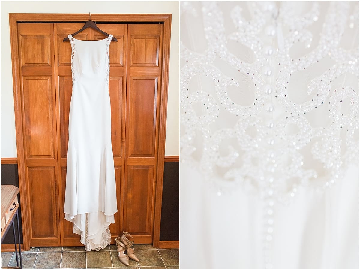 Arielle Peters Photography | Wedding gown hanging on wooden doors on wedding day in Huntington, Indiana.