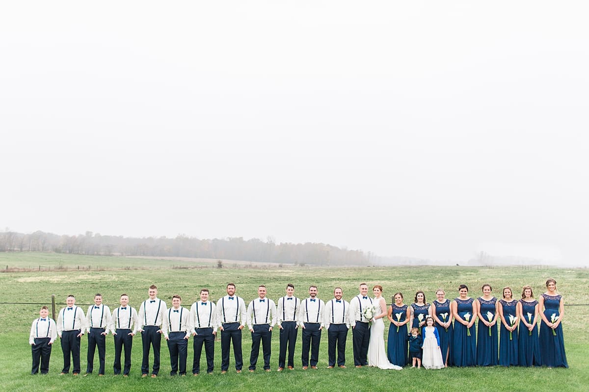 Arielle Peters Photography | Wedding party in open green field on gloomy wedding day in Huntington, Indiana.