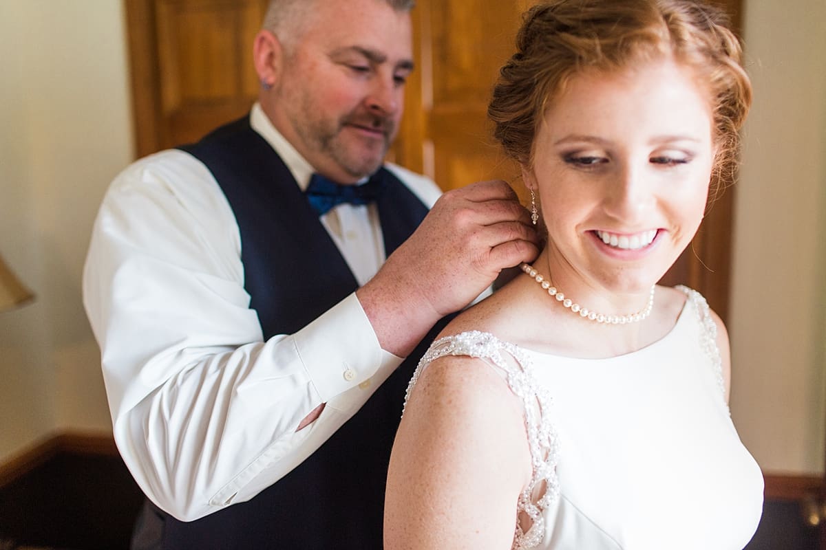 Arielle Peters Photography | Father of bride putting pearl necklace on bride on wedding day in Huntington, Indiana.