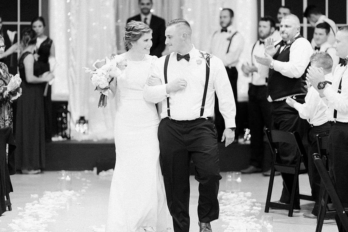 Arielle Peters Photography | Bride and groom walking down the aisle on wedding day in Huntington, Indiana.