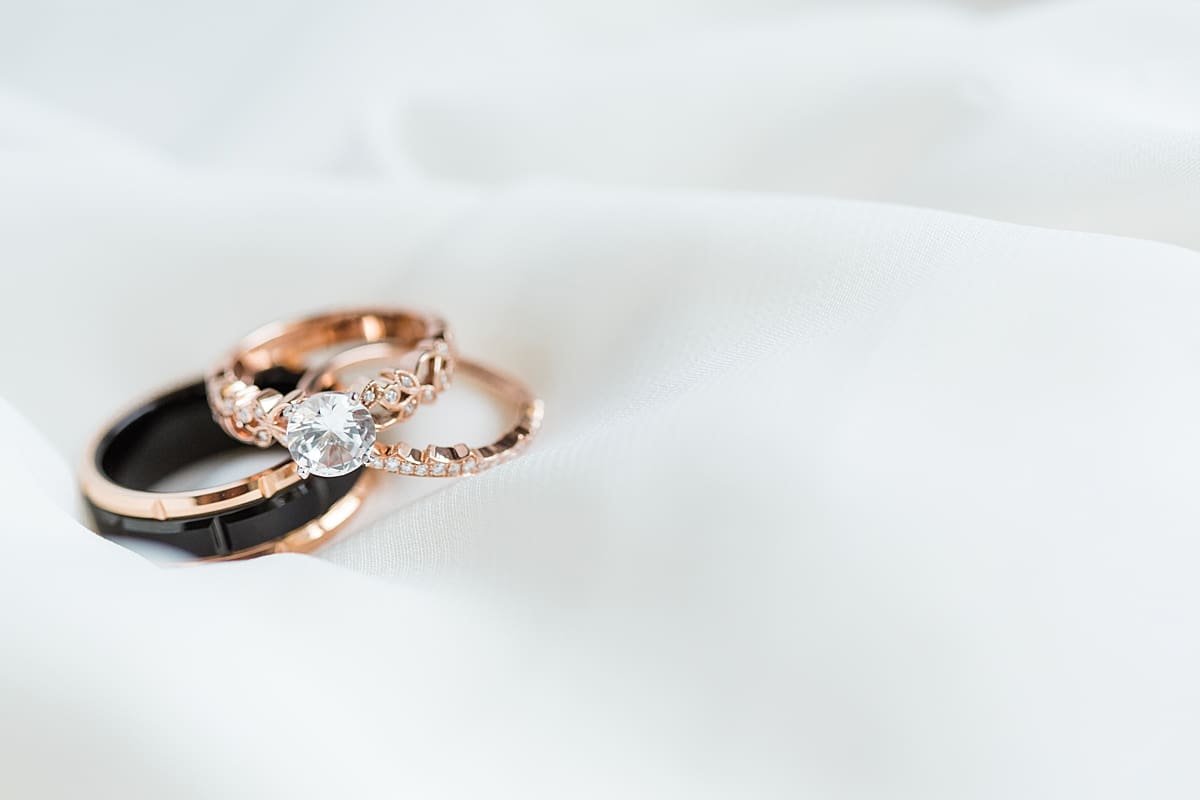 Arielle Peters Photography | Wedding rings on white background on wedding day in Huntington, Indiana.