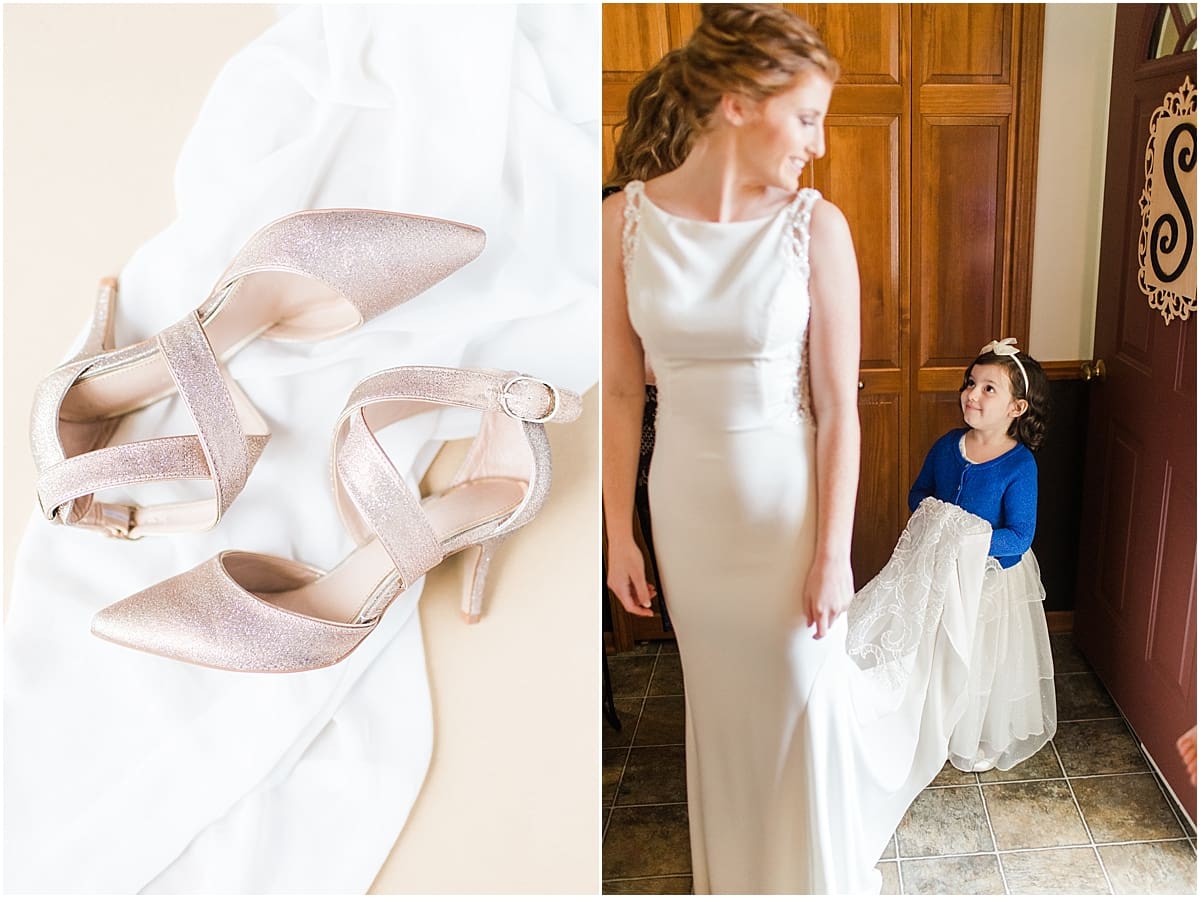 Arielle Peters Photography | Flower girl holding bride's wedding dress train on wedding day in Huntington, Indiana.