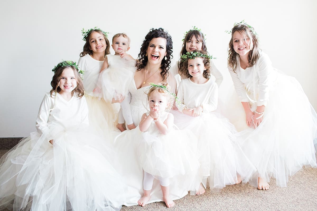 Arielle Peters Photography | Bride and young flower girls in greenery crowns on wedding day.