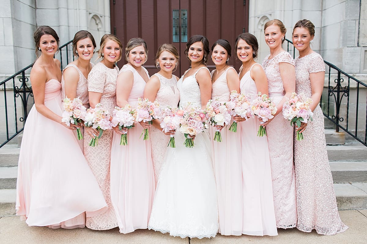 Arielle Peters Photography | Bride and bridesmaids standing on church steps on wedding day.