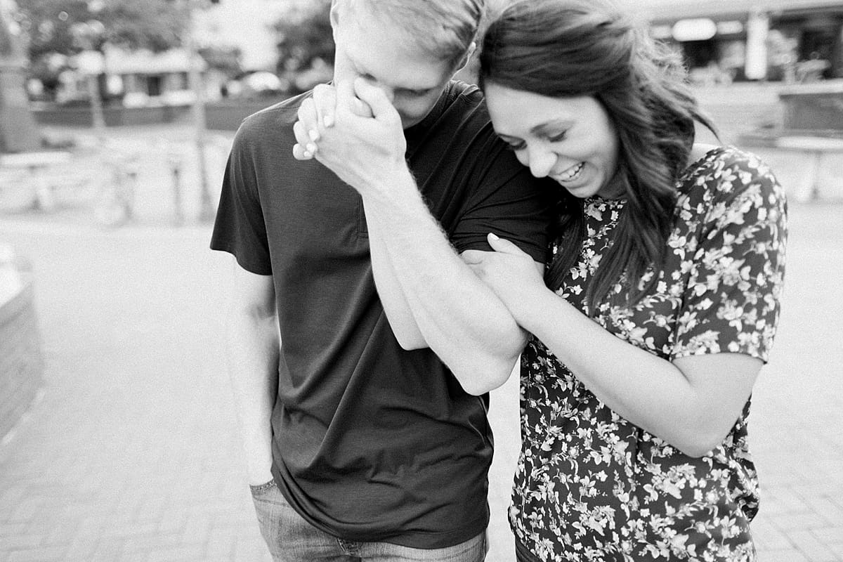 Arielle Peters Photography | Young couple holding hands taking summer engagement photos.