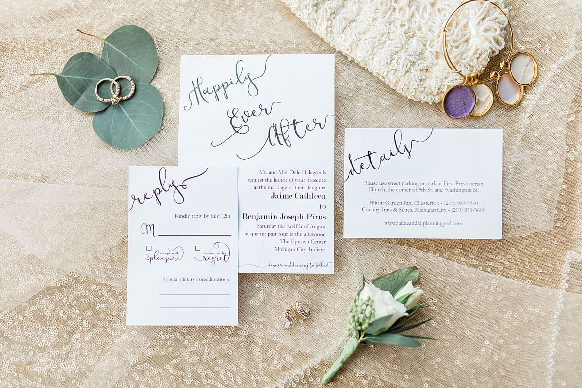 Arielle Peters Photography | Wedding invitations and wedding jewelry on sparkly background on wedding day.