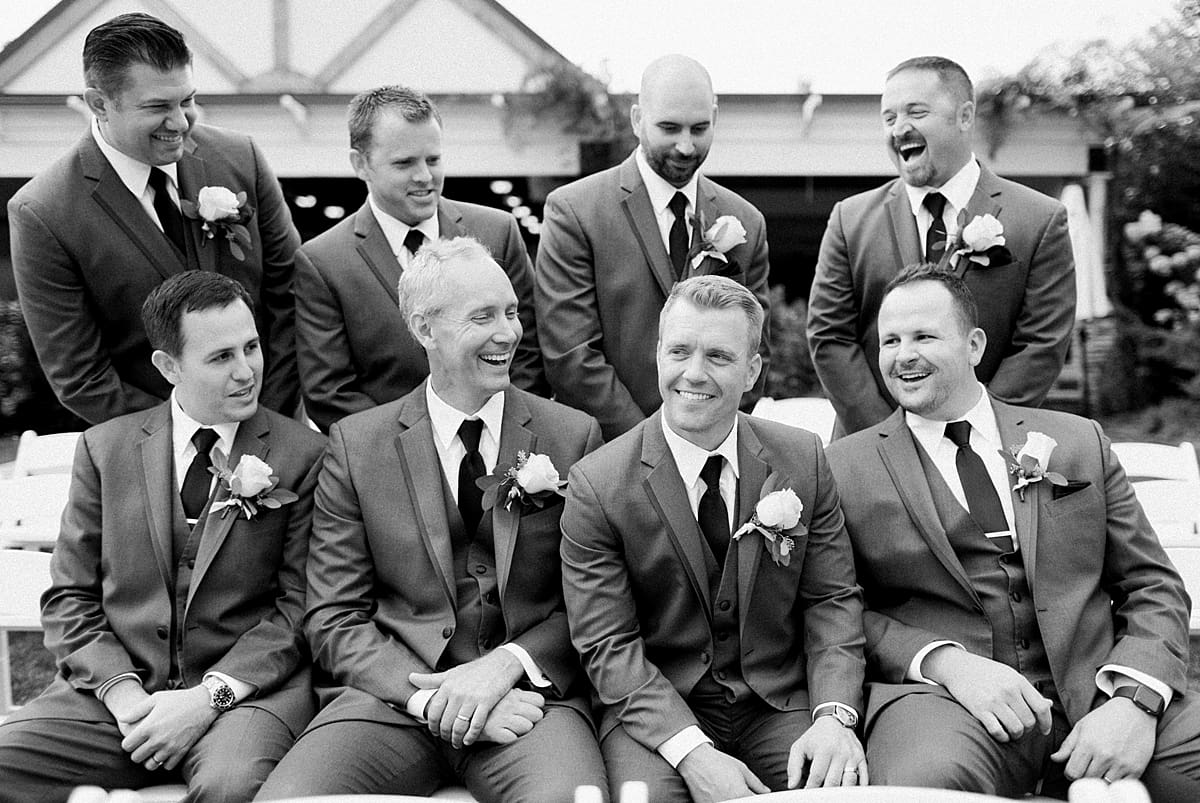 Arielle Peters Photography | Groom and groomsmen laughing and hanging out on wedding day.