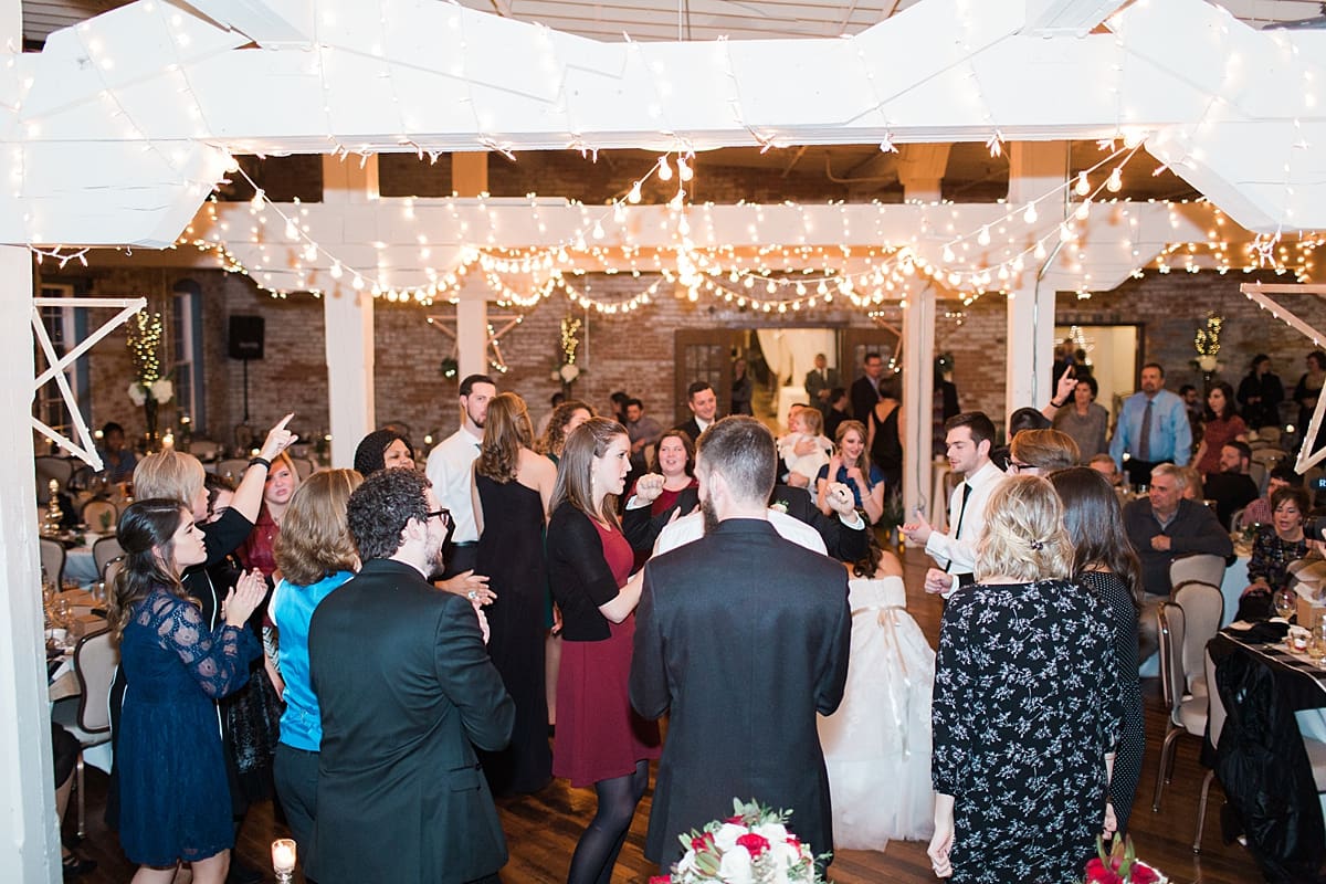 Arielle Peters Photography | Wedding guests dancing at wedding reception on winter wedding day in Goshen, Indiana.