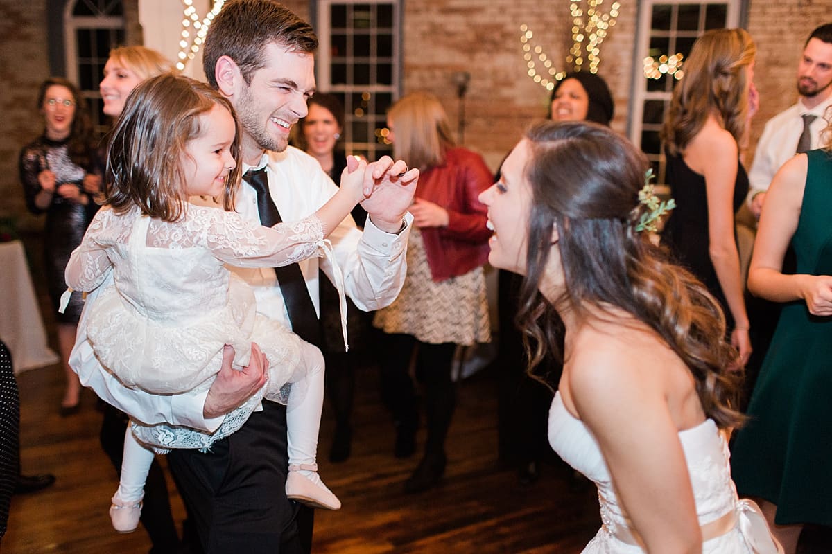 Arielle Peters Photography | Groom dancing with little girl at wedding reception on winter wedding day in Goshen, Indiana.