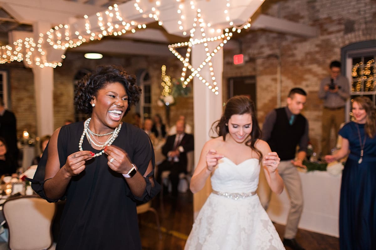 Arielle Peters Photography | Bride dancing with friends at wedding reception on winter wedding day in Goshen, Indiana.