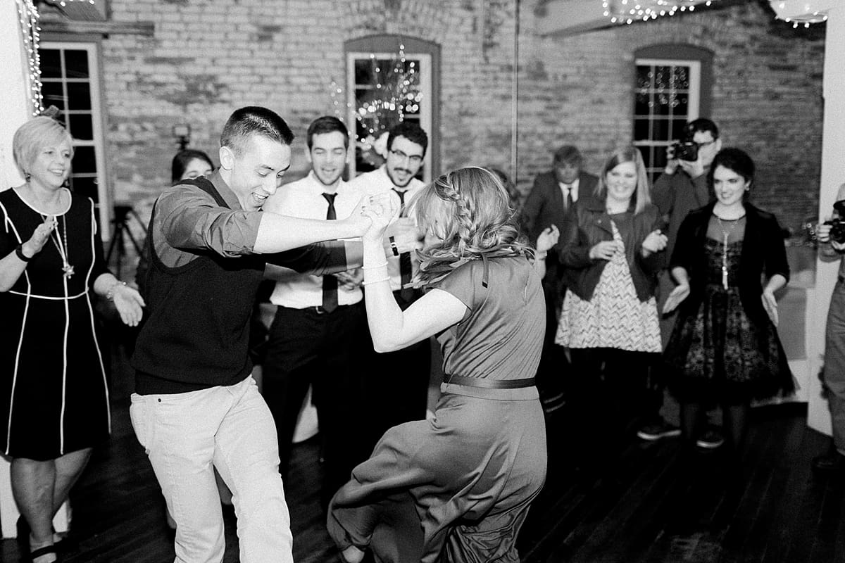 Arielle Peters Photography | Wedding guests dancing at wedding reception on winter wedding day in Goshen, Indiana.