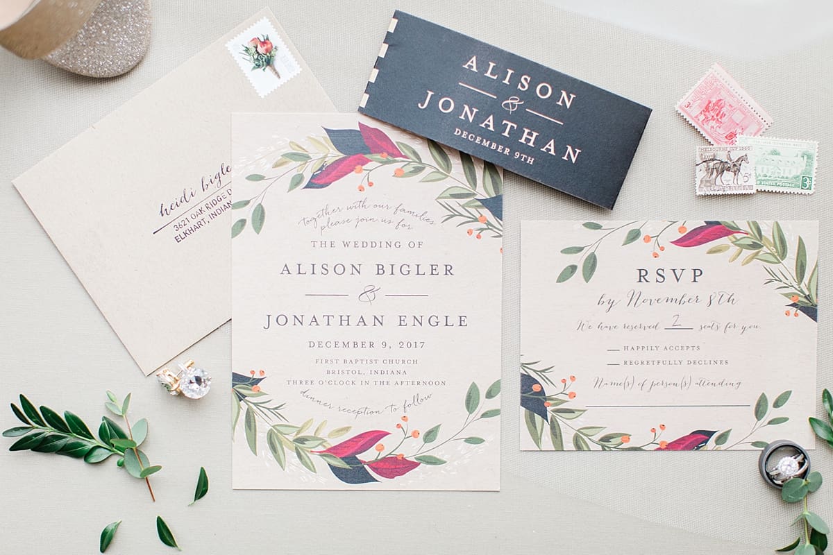 Arielle Peters Photography | Wedding invitation and details on cream background on winter wedding day in Goshen, Indiana.