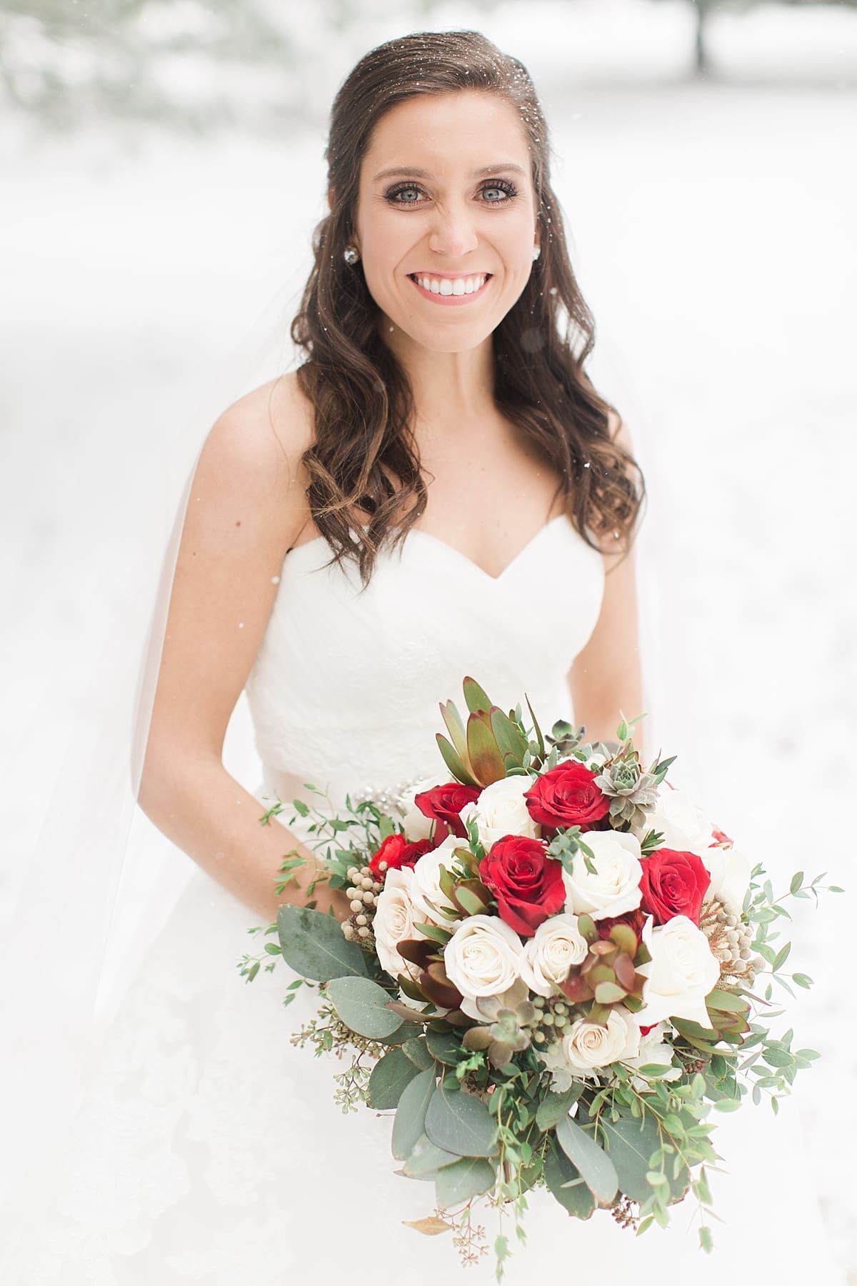 Arielle Peters Photography | Bride outside in the snow on winter wedding day in Goshen, Indiana.