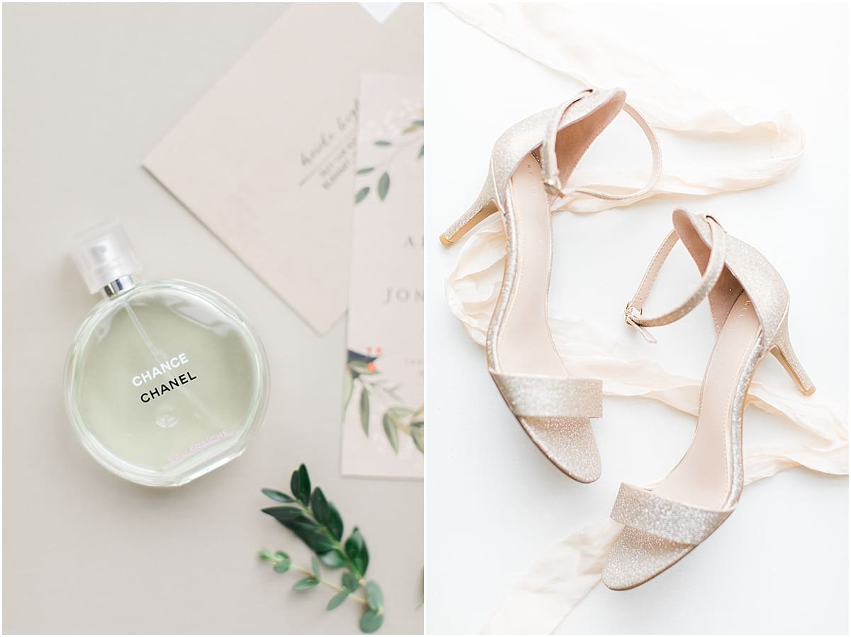 Arielle Peters Photography | Wedding perfume and wedding shoes on cream background on winter wedding day in Goshen, Indiana.