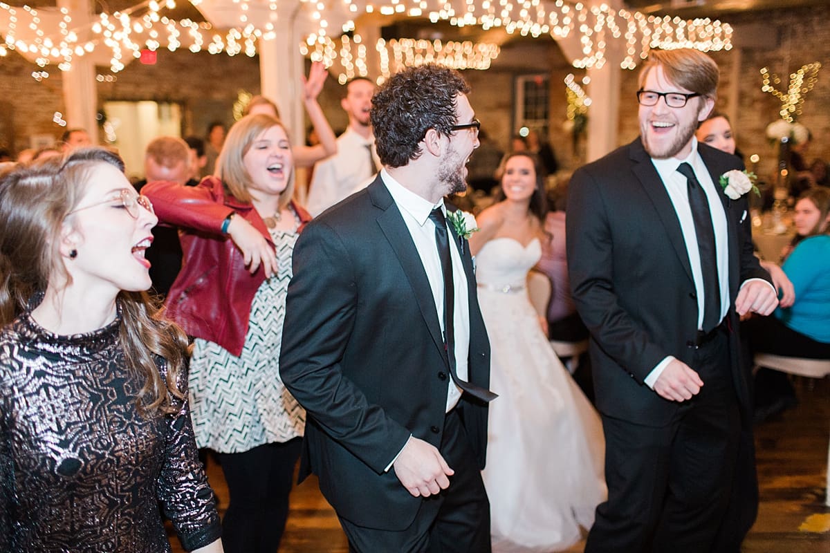 Arielle Peters Photography | Wedding guests dancing at wedding reception on winter wedding day in Goshen, Indiana.