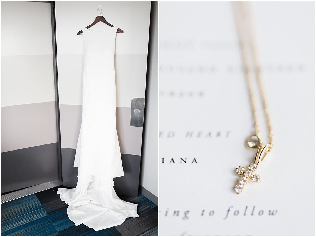 Arielle Peters Photography | Wedding gown hanging in doorway on wedding day inside the Basilica of the Sacred Heart in Notre Dame, Indiana.