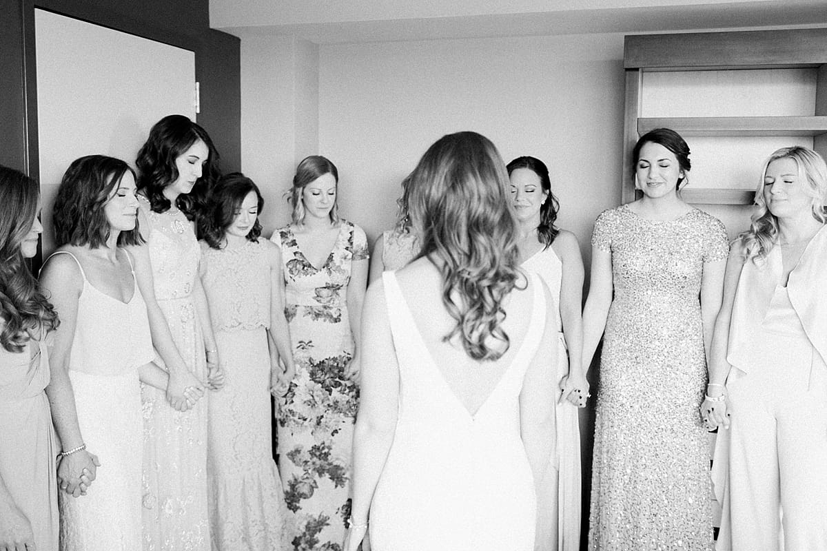 Arielle Peters Photography | Bride and bridesmaids having first reveal on wedding day inside the Basilica of the Sacred Heart in Notre Dame, Indiana.