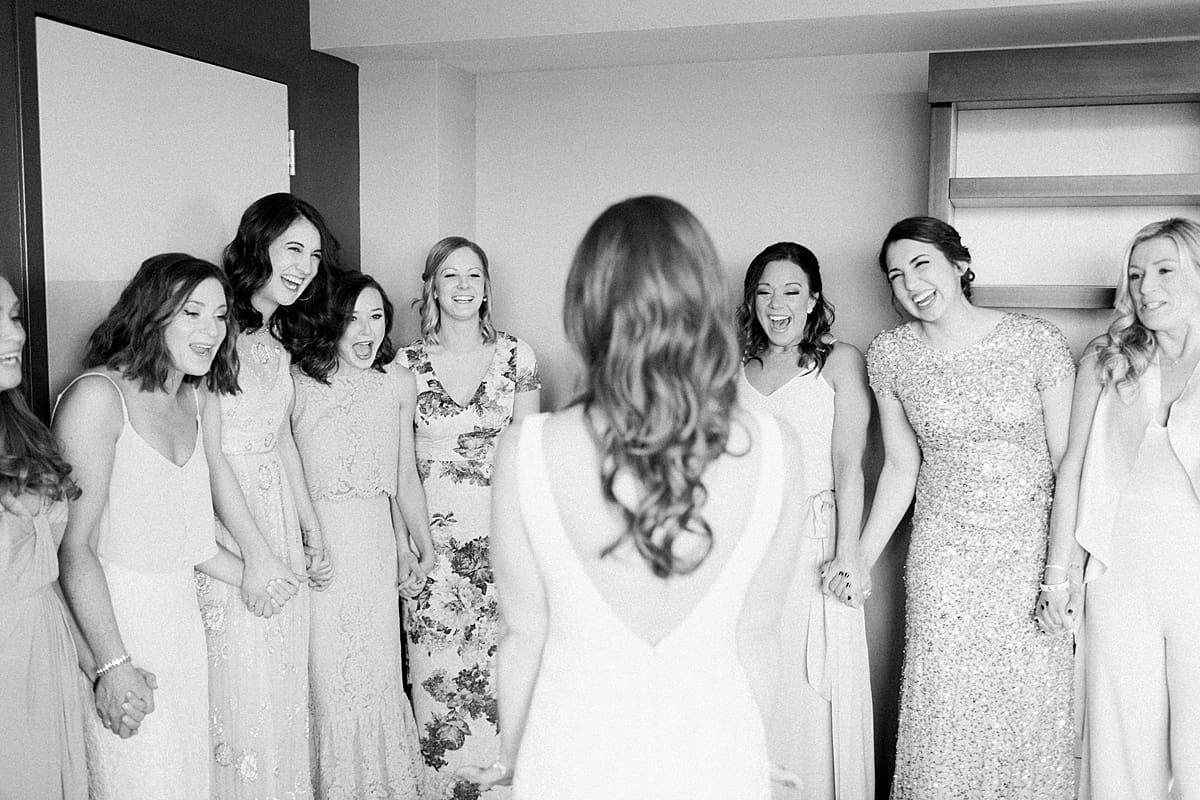 Arielle Peters Photography | Bride and bridesmaids having first reveal on wedding day inside the Basilica of the Sacred Heart in Notre Dame, Indiana.