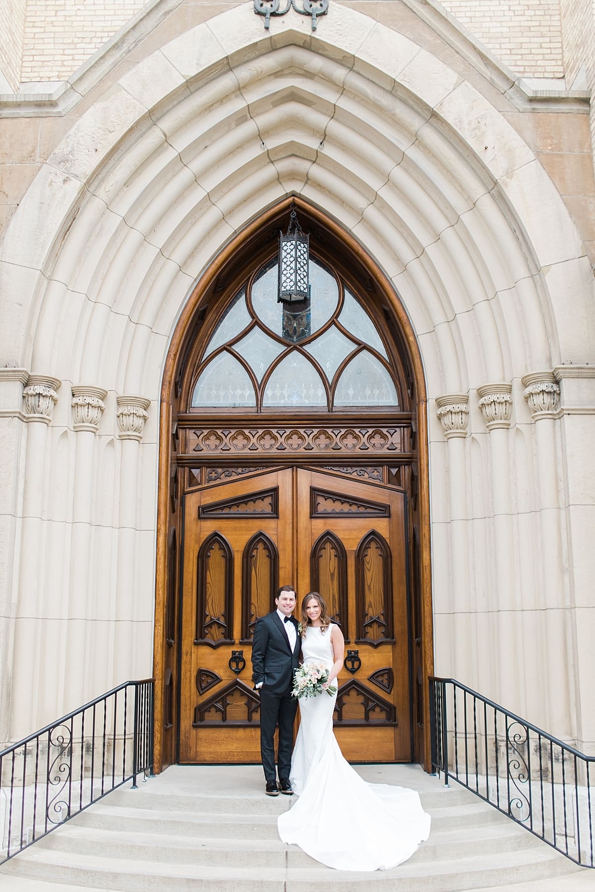 Arielle Peters Photography | Bride and groom outside cathedral doors on wedding day at the Basilica of the Sacred Heart in Notre Dame, Indiana.