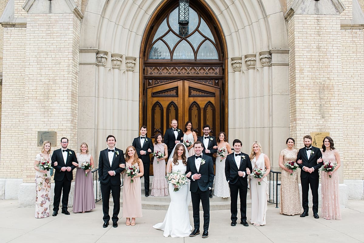 Arielle Peters Photography | Wedding party outside cathedral doors on wedding day at the Basilica of the Sacred Heart in Notre Dame, Indiana.