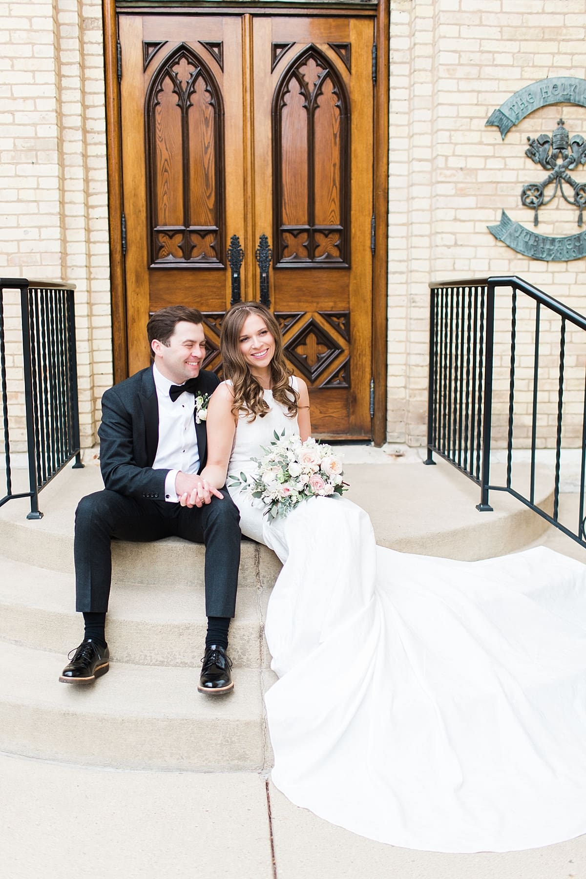 Arielle Peters Photography | Bride and groom outside cathedral doors on wedding day at the Basilica of the Sacred Heart in Notre Dame, Indiana.