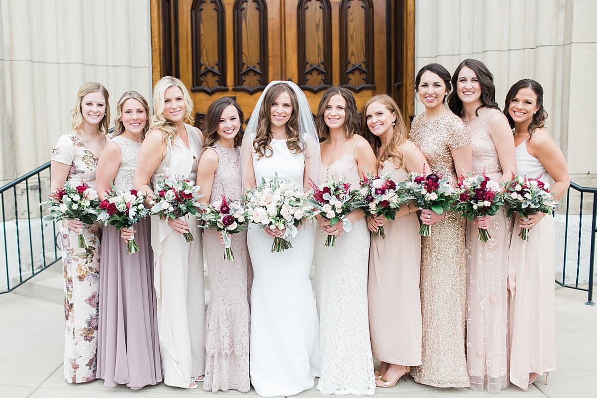 Arielle Peters Photography | Bride and bridesmaids outside cathedral doors on wedding day at the Basilica of the Sacred Heart in Notre Dame, Indiana.