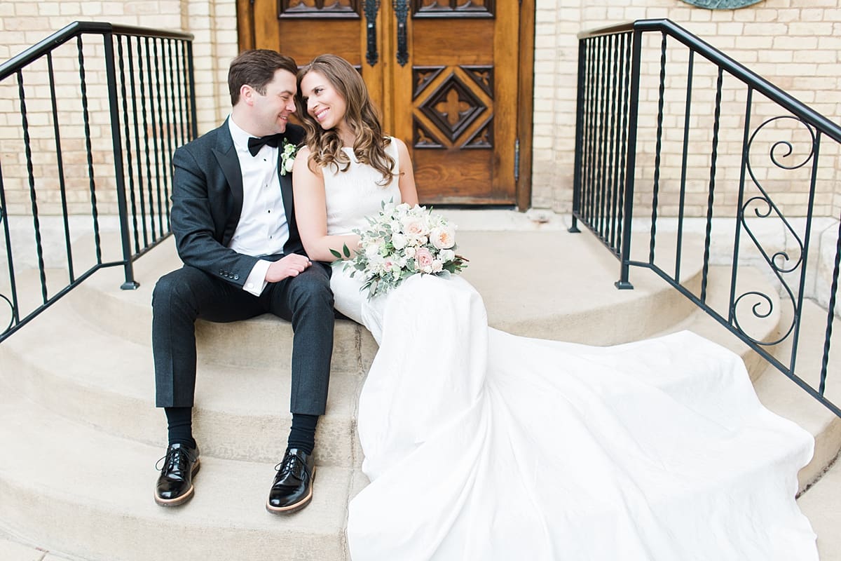 Arielle Peters Photography | Bride and groom outside cathedral doors on wedding day at the Basilica of the Sacred Heart in Notre Dame, Indiana.