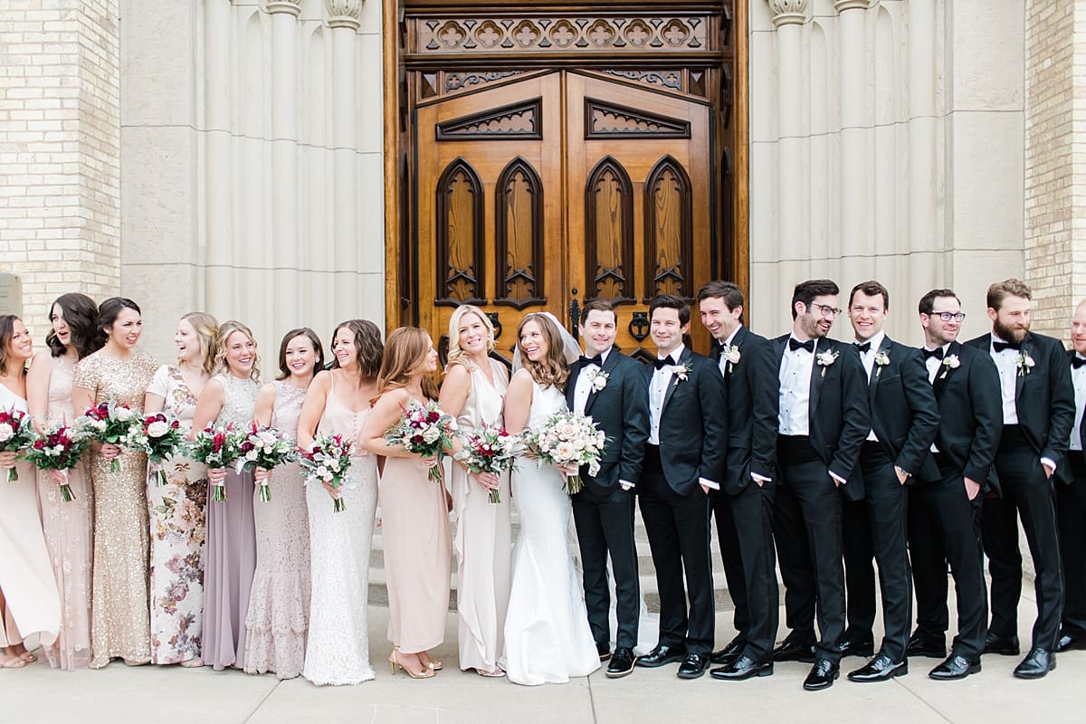 Arielle Peters Photography | Wedding party outside cathedral doors on wedding day at the Basilica of the Sacred Heart in Notre Dame, Indiana.
