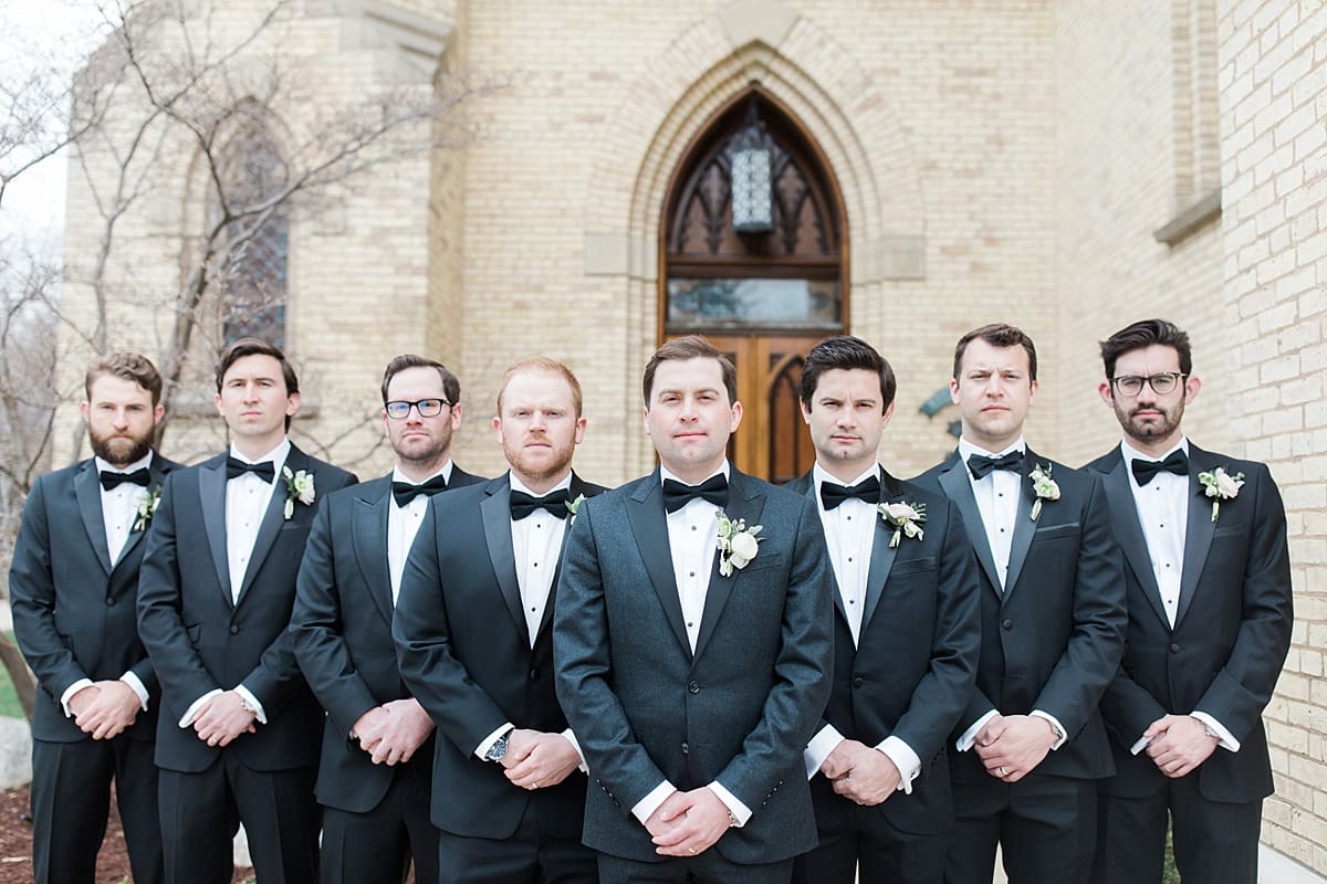 Arielle Peters Photography | Groom and groomsmen outside cathedral doors on wedding day at the Basilica of the Sacred Heart in Notre Dame, Indiana.