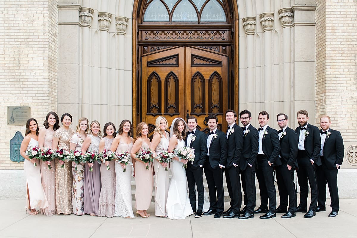 Arielle Peters Photography | Wedding party outside cathedral doors on wedding day at the Basilica of the Sacred Heart in Notre Dame, Indiana.