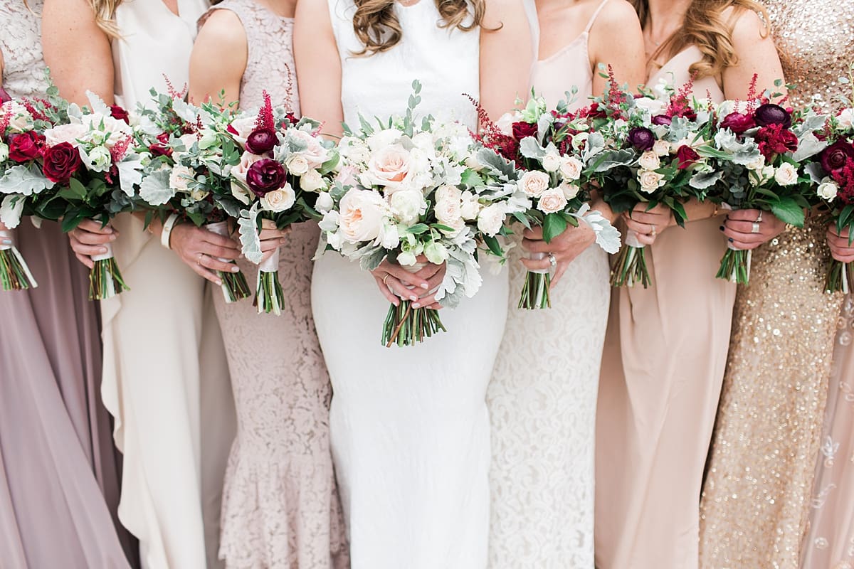Arielle Peters Photography | Bride and bridesmaids holding bouquets on wedding day at the Basilica of the Sacred Heart in Notre Dame, Indiana.