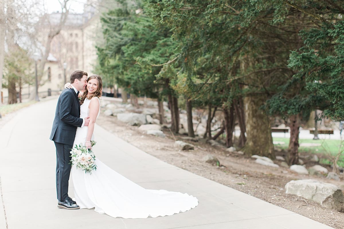 Arielle Peters Photography | Bride and groom walking outside of cathedral on wedding day at the Basilica of the Sacred Heart in Notre Dame, Indiana.