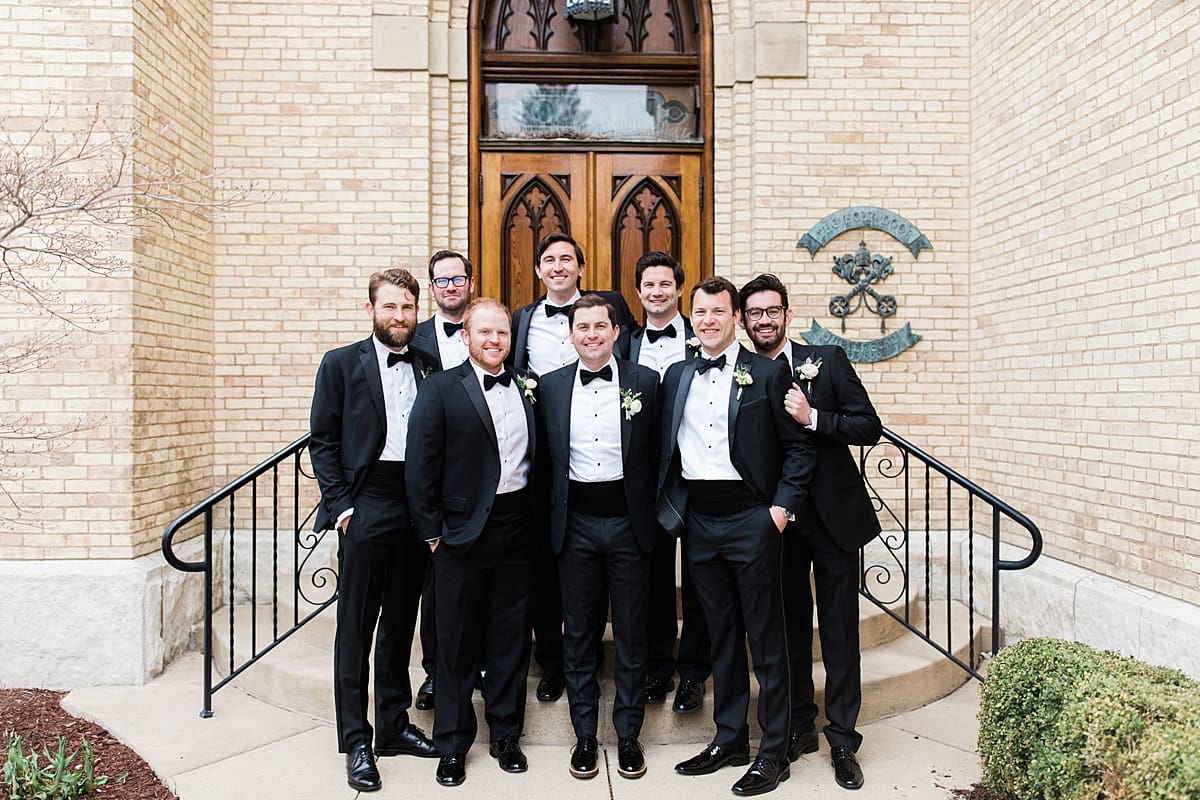 Arielle Peters Photography | Groom and groomsmen in front of cathedral doors on wedding day at the Basilica of the Sacred Heart in Notre Dame, Indiana.