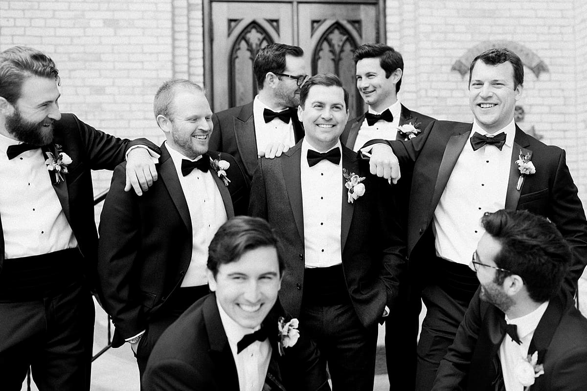 Arielle Peters Photography | Groom and groomsmen in front of cathedral doors on wedding day at the Basilica of the Sacred Heart in Notre Dame, Indiana.