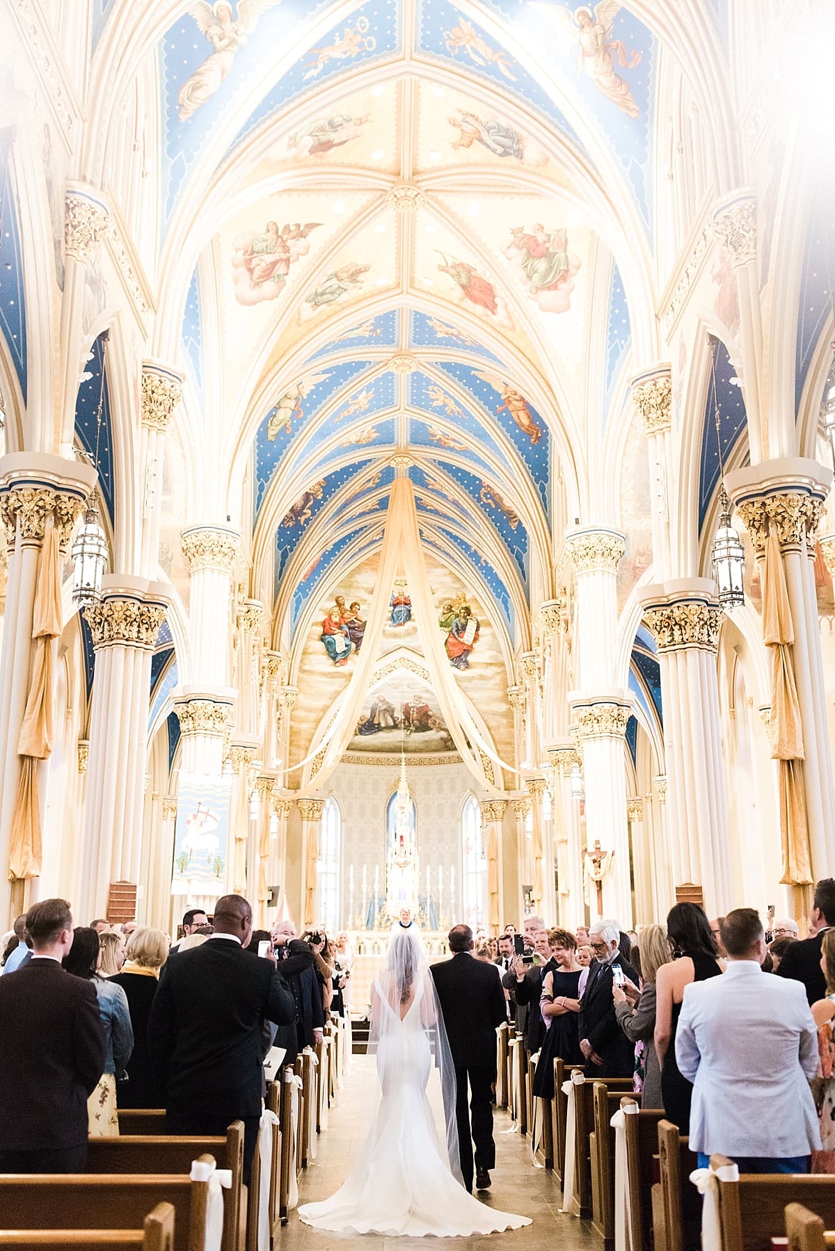 Arielle Peters Photography | Father of bride walking bride down aisle inside cathedral on wedding day at the Basilica of the Sacred Heart in Notre Dame, Indiana.