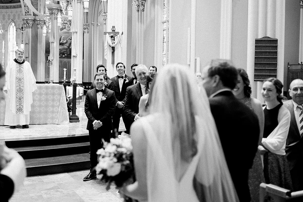 Arielle Peters Photography | Father of bride walking bride down aisle inside cathedral on wedding day at the Basilica of the Sacred Heart in Notre Dame, Indiana.