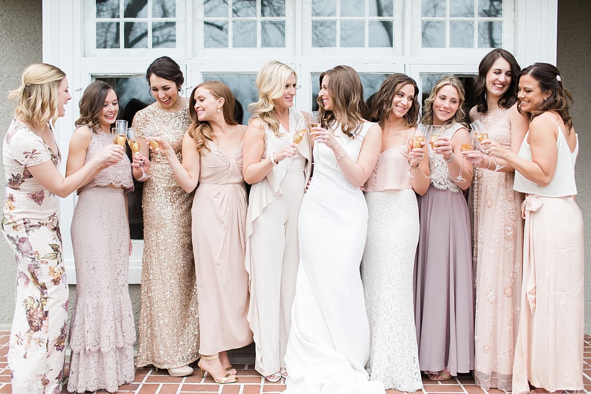 Arielle Peters Photography | Bride and bridesmaids drinking champagne on wedding day at the Basilica of the Sacred Heart in Notre Dame, Indiana.