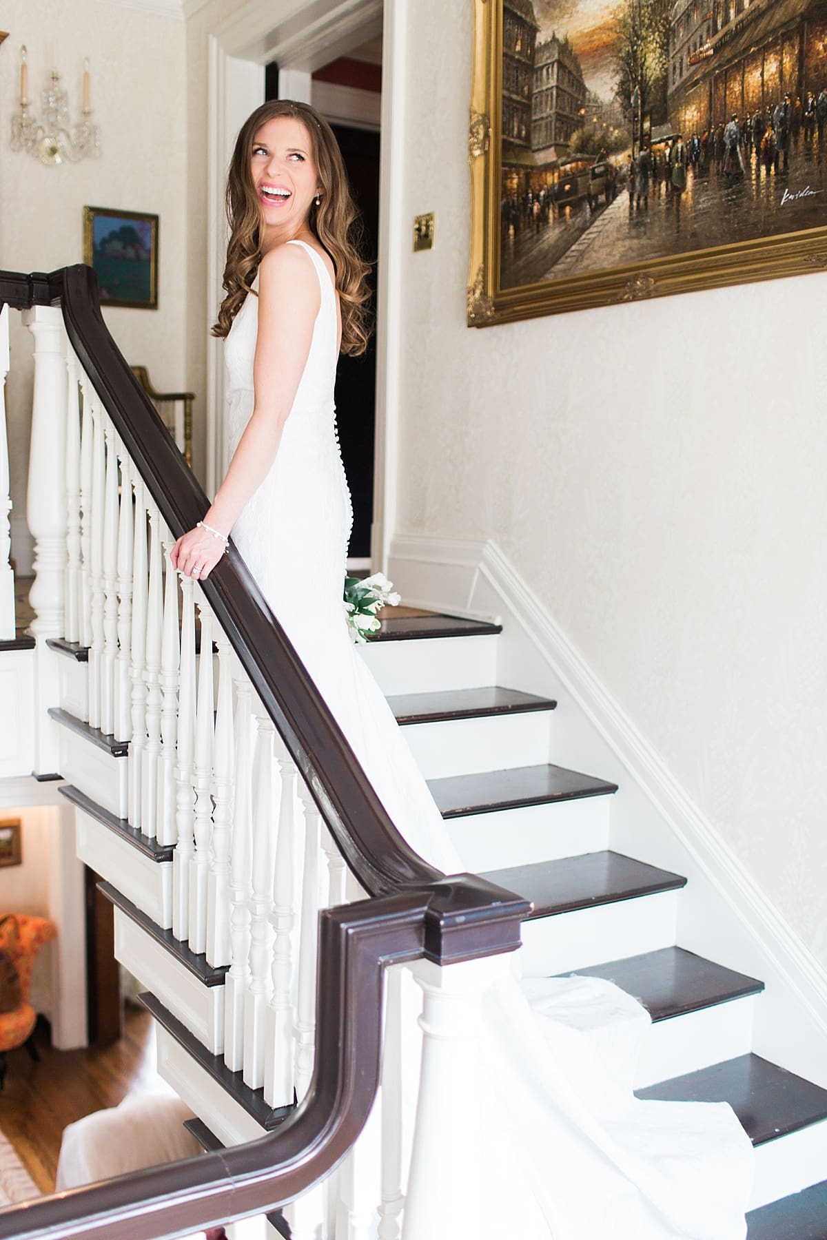 Arielle Peters Photography | Bride walking up stairwell inside cathedral on wedding day at the Basilica of the Sacred Heart in Notre Dame, Indiana.