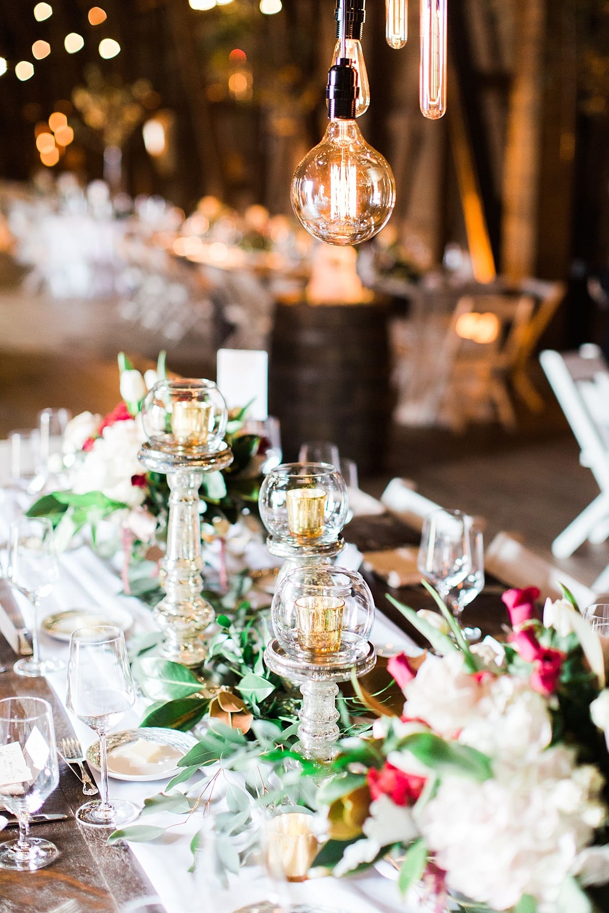 Arielle Peters Photography | Barn wedding reception table settings and floral arrangements on wedding day at St. Joseph's Farm in Granger, Indiana.
