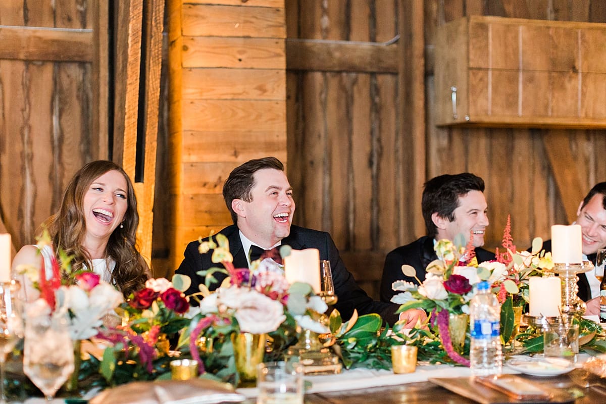  Arielle Peters Photography | Bride and groom laughing at wedding reception on wedding day at St. Joseph's Farm in Granger, Indiana.